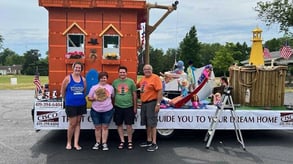 Spencerville Summerfest members with a parade float